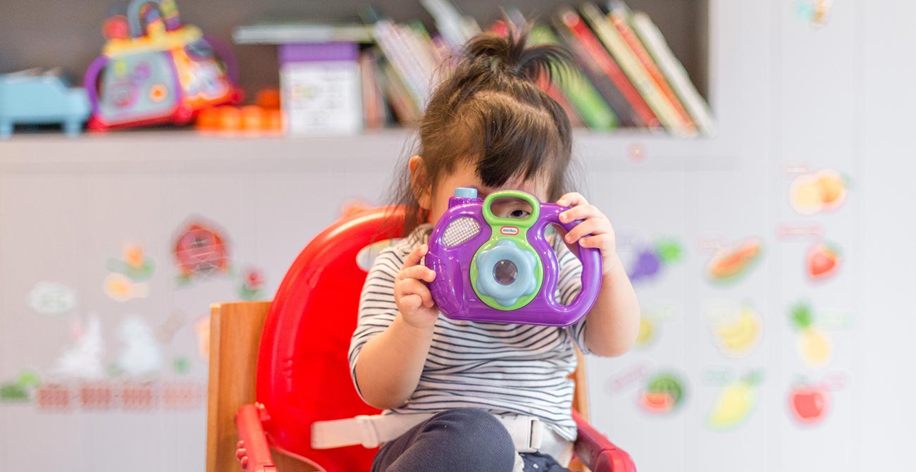 Child playing with toy at REACH Behavior and Development Center