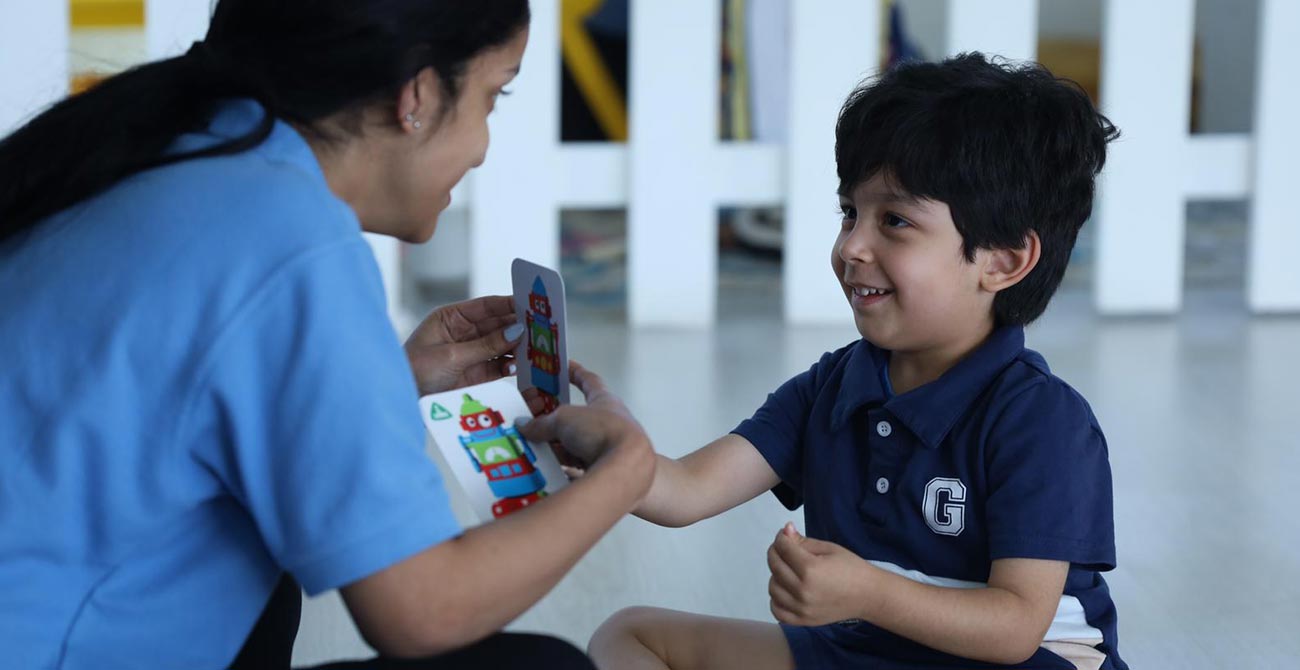 REACH Behavioral and Development Center therapist playing with a kid